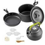 Set of camping cookware including pots, pans,
