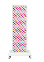 White radiator with colorful polka dot pattern on a white background