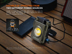 Fenix CL27R flashlight with power source information on a wooden surface