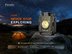 Fenix CL27R outdoor lantern on a rock with a starry night sky and tent in the background, featuring the brand 'Fenix'.