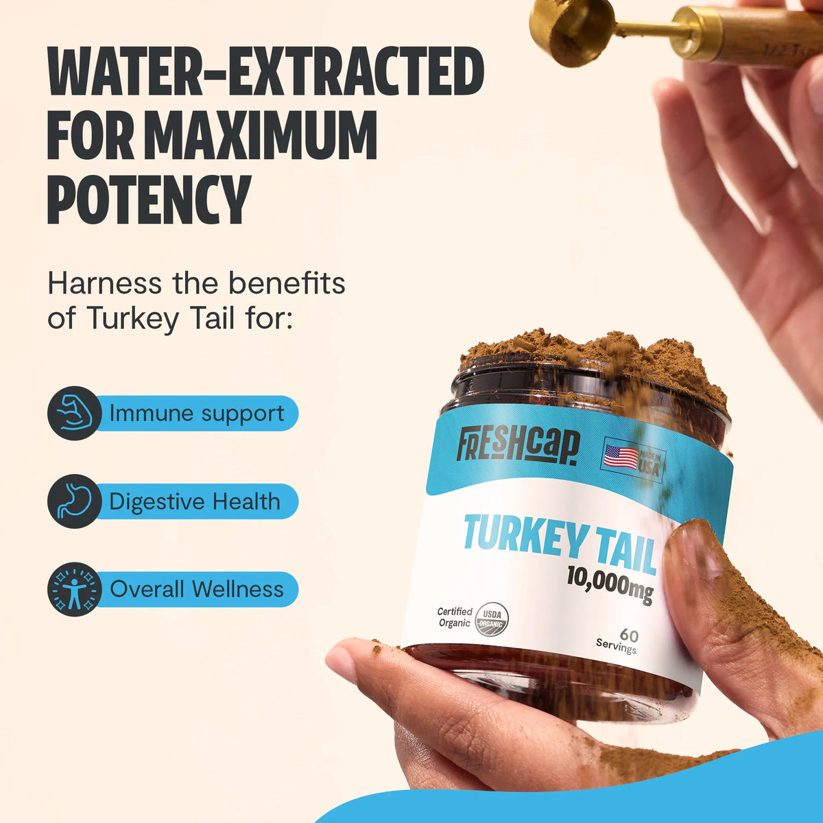 Turkey tail supplement jar with a hand holding it, labeled 'Freshcap', on a light background.
