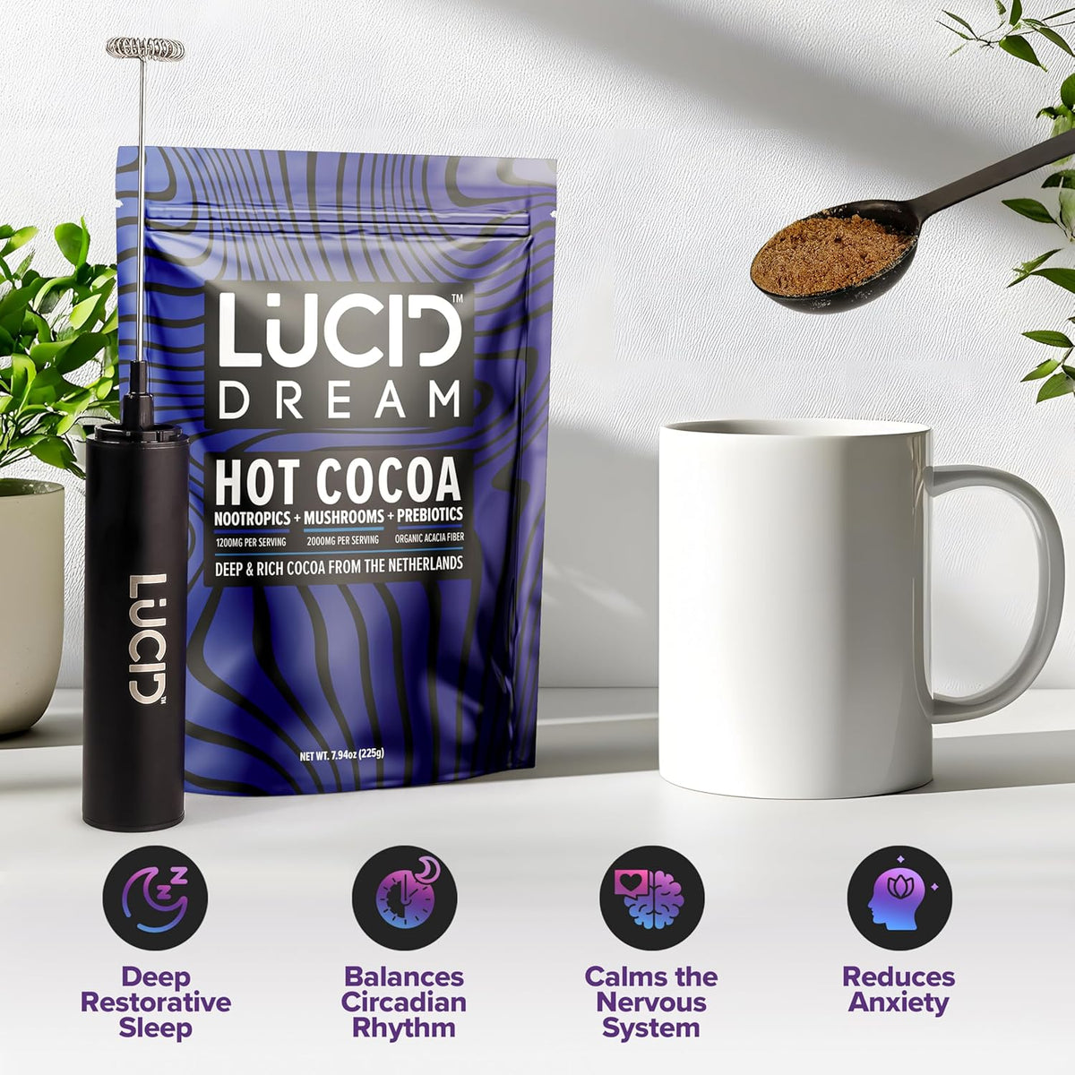 Lucid Dream Hot Cocoa powder pouch in blue and purple packaging, shown with a black frother, a white mug, and a spoon of cocoa powder on a light surface with decorative plants. Four benefit icons below describe deep restorative sleep, circadian rhythm balance, nervous system calm, and anxiety reduction.