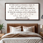Framed motivational quote above a bed in a bedroom setting