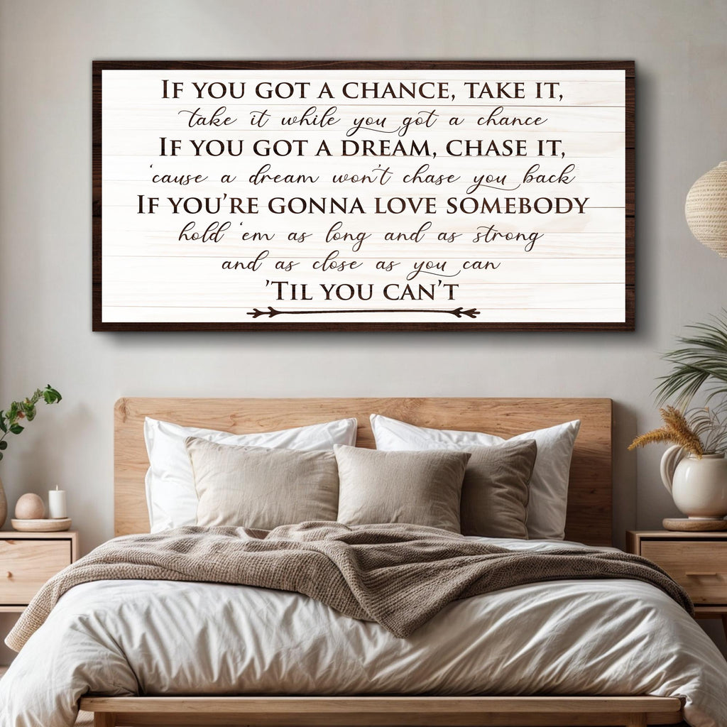 Bedroom with motivational quote wall art above a bed