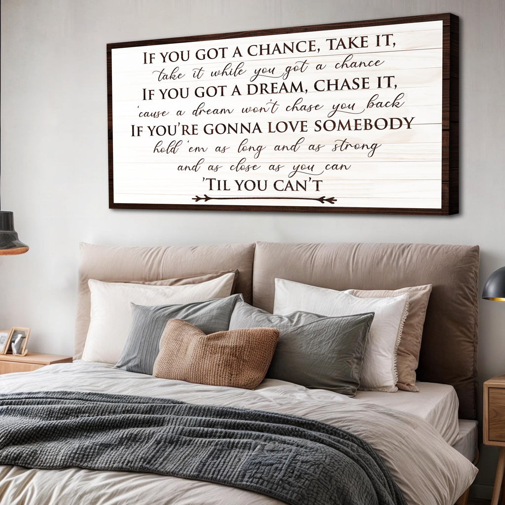 Bedroom with motivational quote canvas on the wall