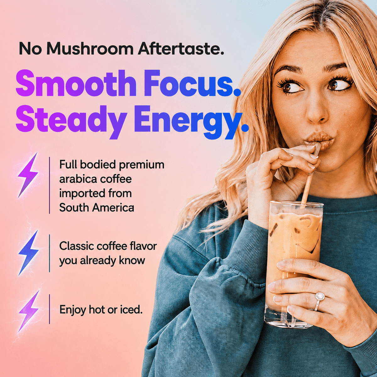 A woman in a blue sweatshirt drinks an iced coffee from a clear glass with a straw against a pink-to-blue gradient background with promotional text about smooth focus and steady energy.