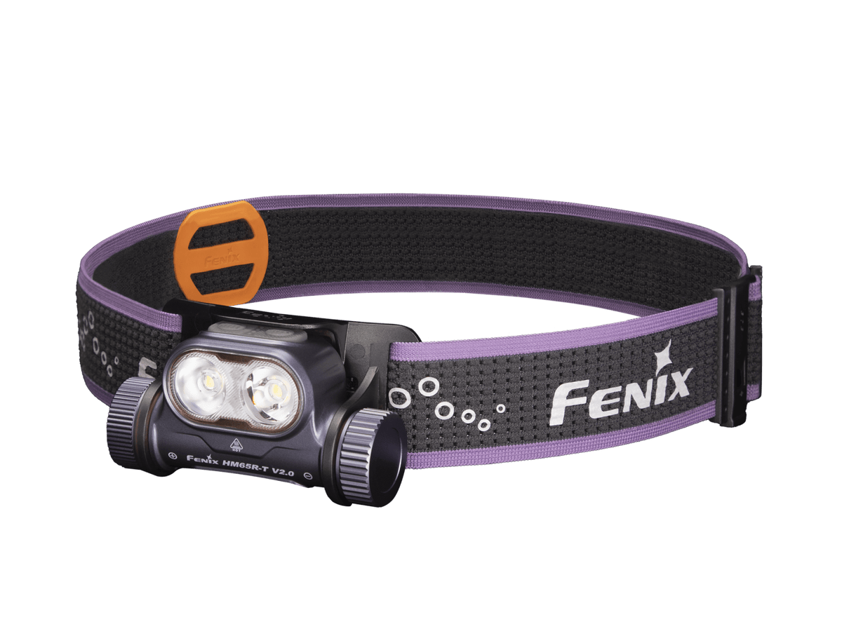 A Fenix headlamp with a purple and black adjustable headband, featuring two LED lights, shown on a solid white background.