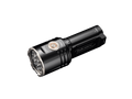 A black tactical flashlight with a silver bezel and a circular orange accent ring, shown on a plain white background.