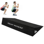 Black wedge squat bench with 'SQUAT WEDGIEZ' printed in white on the top surface, shown on a white background with two small inset images of a man demonstrating a squat using the wedge.