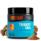 Jar of Freshcap Turkey Tail mushroom extract powder on a white background