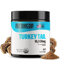 Freshcap Turkey Tail supplement jar with mushrooms and powder on a white background