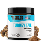 Freshcap Turkey Tail supplement jar with mushrooms and powder on a white background